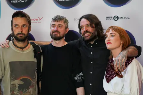 Reuters The band Lankum posing together - they are three men and one woman