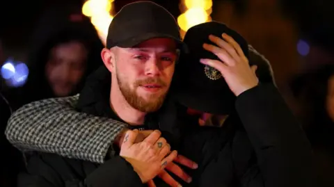 Reuters People react outside the "Le Constellation" bar