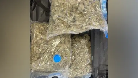 POLICE HANDOUT Three large clear bags full of cannabis 