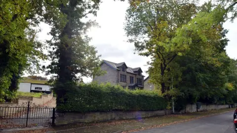 House and trees on Staveley Road in the Nab Wood area 