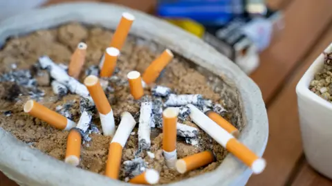 Getty Images An ash tray containing lots of cigarette butts