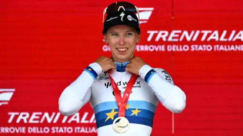 Lorena Wiebes of Netherlands and Team SD Worx-Protime celebrates at the podium