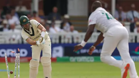 Pat Cummins is bowled by Lungi Ngidi