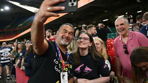 Pat Lam, Bristol Bears' director of rugby, poses for a photo with fans following the Premiership rugby match between Bristol Bears and Bath Rugby at Principality Stadium