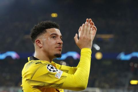 Jadon Sancho claps the Borussia Dortmund fans as he is substituted