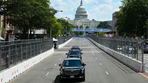 The Beast driving down the track with the Capitol building in the background
