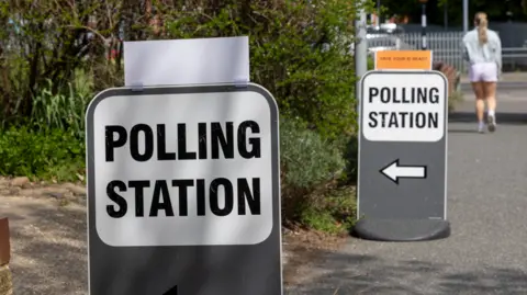 Getty Images Members of the public head to their local polling stations to vote in the local council elections for their next council leaders