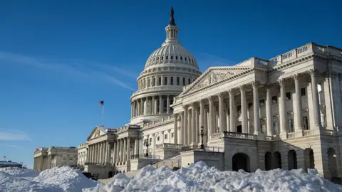 The US Capitol building in Washington, DC, on Friday, Jan. 30, 2026. There is snow in the foreground of the image.