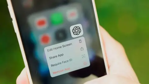 Getty Images The ChatGPT app is seen on an iPhone home screen.
