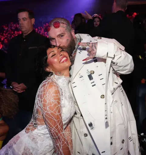 Getty Images Teddy Swims kisses his partner Ritchie Wright on the forehead as they attend the MTV Video Music Awards in September 2024