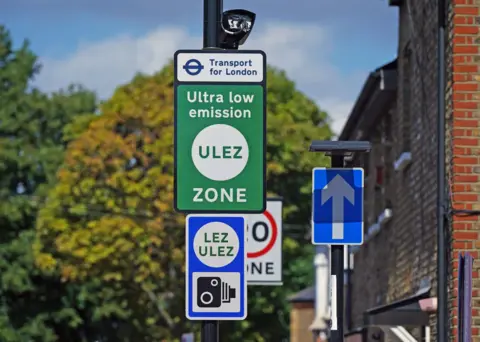 PA Media Green and blue Ulez sign with camera