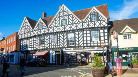 Getty Images Medieval half timbered building Claridges of Warwick shop in the high street. 