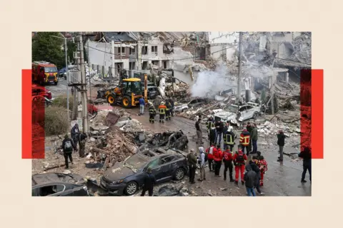 Global Images Ukraine via Getty Images Rescuers clear debris at the site of a Russian strike on a residential district in Kyiv, Ukraine
