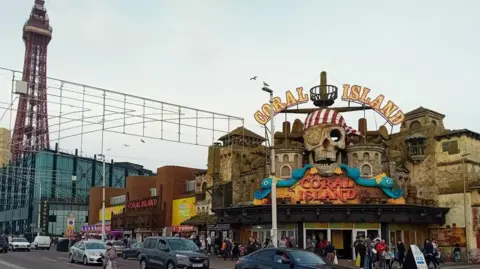 Coral Island amusement centre Blackpool promenade with Blackpool Tower in the background
