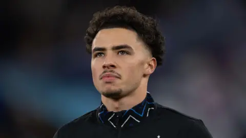 Chemsdine Talbi looks whimsically into the distance as Club Brugge line up for a Champions League game