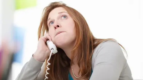 Getty Images Frustrated woman on phone