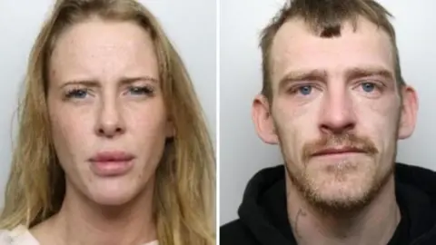 South Yorkshire Police Two custody photos side by side. On the left, a woman with long blonde hair and blue eyes in a white top against a grey background. On the right, a man with short light brown hair, gingery facial hair, blue eyes. He has a tattoo on his neck and is wearing a black hoody.