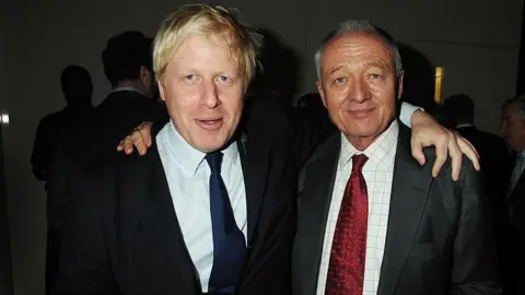 Getty Images Boris Johnson and Ken Livingstone at a social event with their arms on eachother's shoulders. Both are wearing dark suits, Johnson is wearing a dark blue tie and Livingstone is wearing a red tie. 