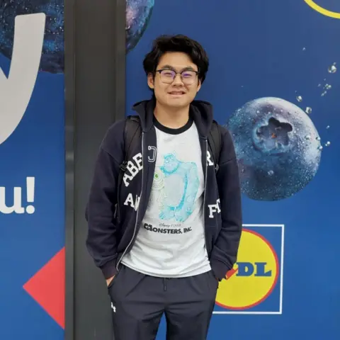 Nick, a student, stands outside Lidl