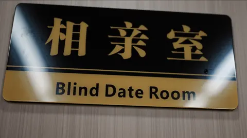 A sign reading "blind date room"