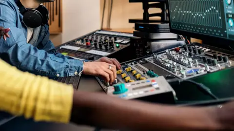 Getty Images Generic images of young people in a music studio