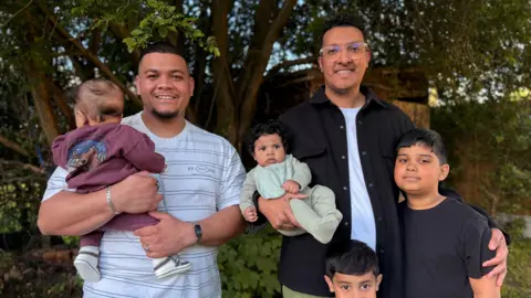 Naeem (left) and Shuaeb (right) with their children