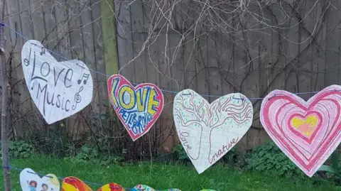 Nene Park Trust Cut out hearts strung along a garden