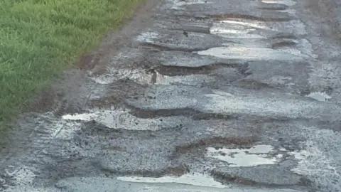 BBC / Natalie Bell Potholes in Sutterton Drove