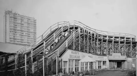 Rob Ball The Scenic Railway in Dreamland, Margate, Kent, in the early days. The image is in black and white, and Arlington House can be seen in the background.