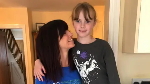 BBC News Willow standing next to her mother Lindsey