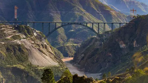 Getty Images A view of the newly constructed Chenab Bridge on the Udampur-Srinagar-Baramulla-Rail link during its media preview in Reasi district, on March 26, 2023 in Katra, India.