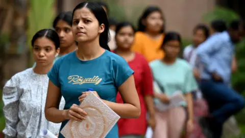  Candidates leave after appearing for National Eligibility-cum-Entrance Test (NEET-UG) exam at Cambridge school in Sector 27 Noida on May 5, 2024 in India