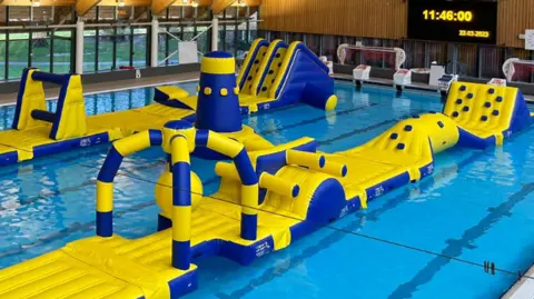 Brighton and Hove Council An artist's impression of inflatables in a pool