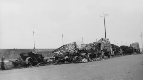 A row of destroyed trucks on St Peter Port harbour after the bombing.