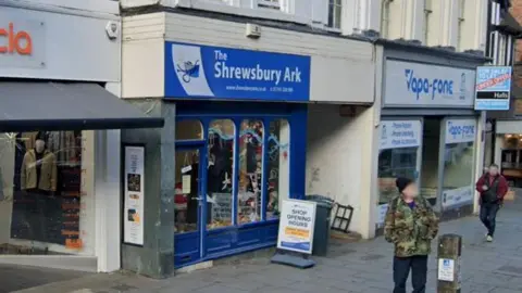 Google The front of a shop with a blue sign which reads Shrewsbury Ark