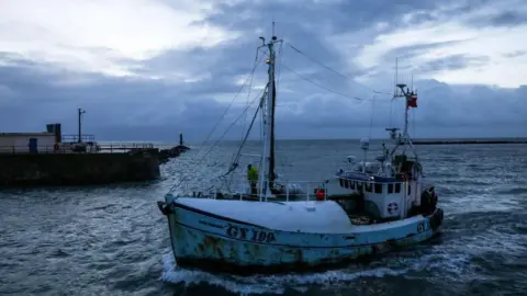 Simon Dawson/Bloomberg via Getty Images A fishing boat returns from the English Channel to Ramsgate Harbour in Ramsgate