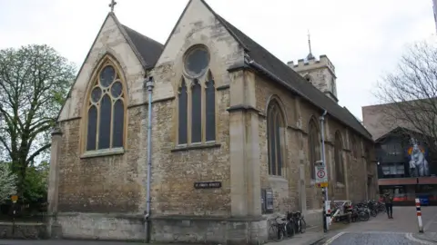 St Ebbe's is an old traditional church with a small tower at the other end.