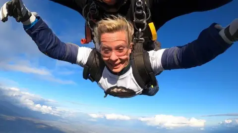 Clair Todd just out of the plane with a look of terror and joy on her face 