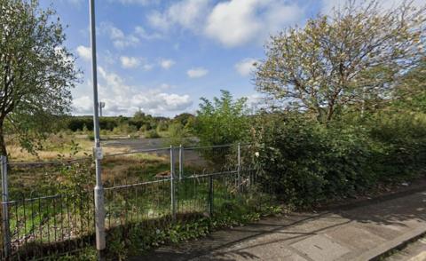 A derelict site where the village hall would be built