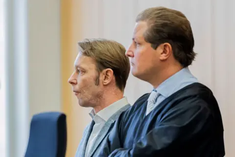 MICHAEL MATTHEY/POOL/AFP Christian B (L), defendant and prime suspect in the 2007 disappearance of missing British toddler Madeleine McCann, stands next to his lawyer Friedrich Fuelscher