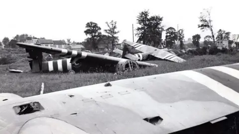 PA Media Black and white image of gliders landed in a field in France on the 6 June 1944