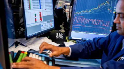 Getty Images A trader on Wall Street watching stocks on 5 August '24