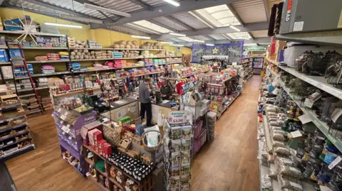 Paul Moseley/BBC An elevated view of a shop selling various pet-related goods.
