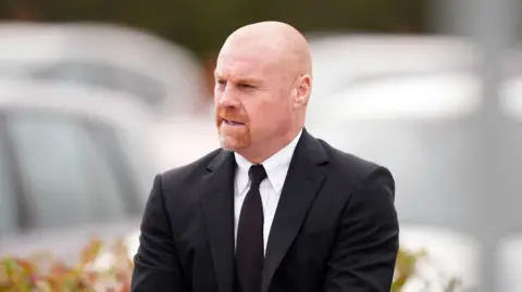 PA Media Sean Dyche at John Robertson funeral wearing a black suit and tie and formal white shirt