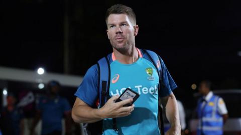 David Warner steps off the Australia team bus before a match at the T20 World Cup  