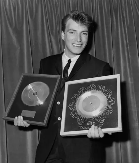 Getty Images Frank Ifield with gold and silver discs in 1963