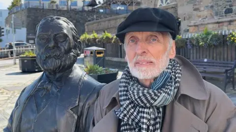 BBC Jean-Baptiste Hugo with Victor Hugo statue