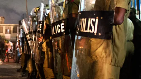 AFP Tanzanian riot police stand guard