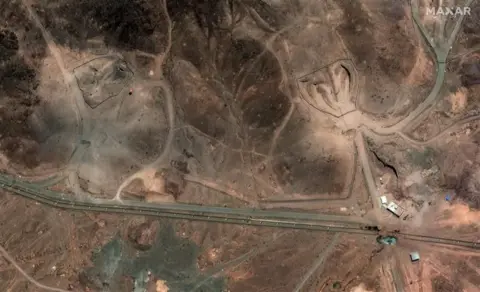 A satellite image shows new airstrike craters at an entrance to the Fordo 