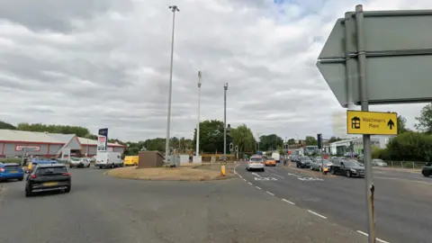 Google A street view of a road junction. Many cars are driving along the various carriageways.